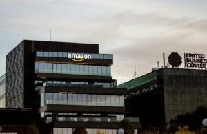 Contemporary architecture showcasing Amazon office at dusk in Iași, Romania.